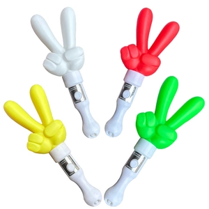 Glow sticks in victory gesture shape with red white yellow and green light effects