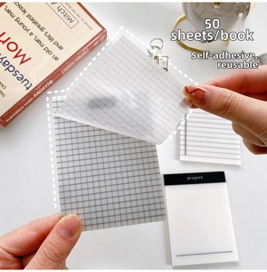 Detail of peeling a translucent grid sticky note showing clear transparency and adhesive