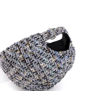 Tweed baseball cap with adjustable metal buckle and textured woven fabric back view