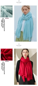 Detail of soft fabric texture and fine fringe on sky blue and red long scarves