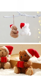 Detailed view of plush Christmas teddy bears with red hats and gift boxes for tree decor
