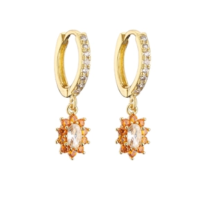 Golden flower hoop earrings with orange and clear zircon stones on a white background