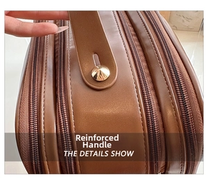 Close-up of reinforced brown leather bag handle with golden cone rivet details