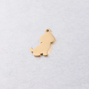 Close-up of golden stainless steel puppy pendant with smooth finish and jump ring