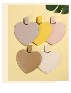 Detailed view of colorful heart-shaped PU leather charms with matching hanging loops