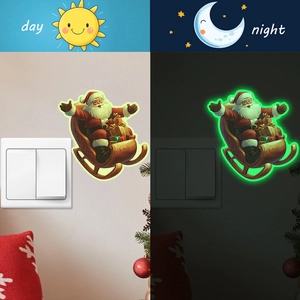 Glow in the dark Christmas Santa sleigh wall stickers shown in day and night lighting