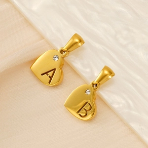 Gold heart initial pendant with A and B letter cutouts and a small sparkling crystal