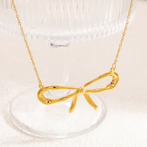 Elegant 18k gold plated titanium steel butterfly pendant necklace on glass stand
