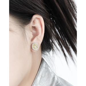 Two-tone S925 sterling silver stud earrings with geometric woven texture on earlobe