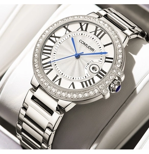 Macro shot of silver bezel with crystals, Roman numerals, and blue watch hands