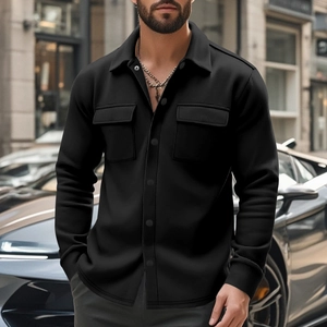 Detail of black slim fit jacket with buttoned flap pockets and a premium collared design