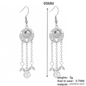 Silver alloy tassel earrings with fishtail chain, shell disc and pearl pendants detail