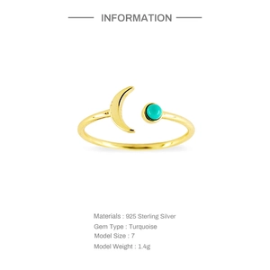 Detail view of gold 925 sterling silver three-layer ring with turquoise moon and bead accents