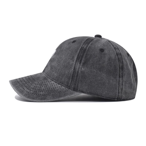 Detail view of washed distressed cotton baseball cap with embroidered heart on the side