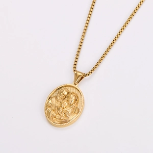 Close-up of vintage embossed Holy Family oval pendant on a gold box chain necklace