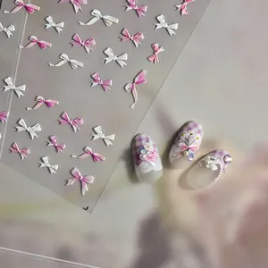 3D embossed bow nail stickers in pink and white with Lady First text and butterfly design