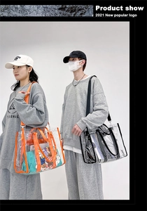 Detailed view of large transparent PVC tote bags with adjustable straps worn by models