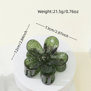 Translucent dark green flower hair claw with gold glitter and black teeth for women