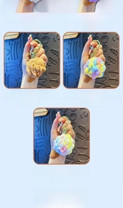 Detailed macro of handmade crochet plush ice cream keychain in five various colors