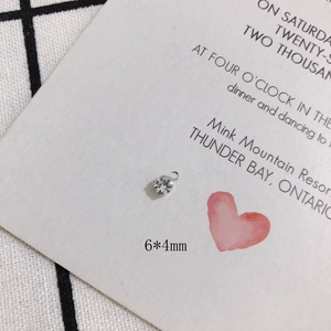 Macro shot of 6x4mm silver mini rhinestone charms for DIY earring jewelry making