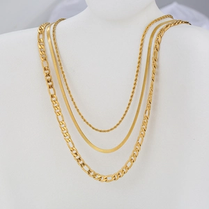 Three-layer gold stainless steel necklace set with Cuban and snake chains on a mannequin