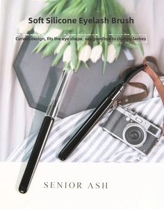 Detail of professional black silicone eyelash brushes with clear protective covers for travel