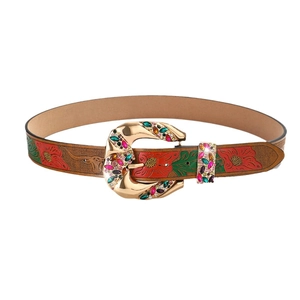 Brown leather belt with floral embossing and gold buckle inlaid with colorful stones