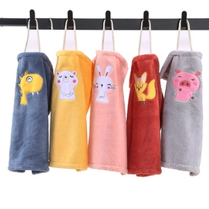 Close-up of coral fleece hand towels with cute animal embroidery and hanging loops
