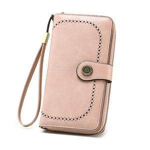 Dusty pink long women's wallet with laser-cut dots and sunflower buckle closure