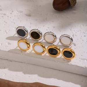 Classic geometric oval stud earrings set in gold and silver steel with black and white inlay
