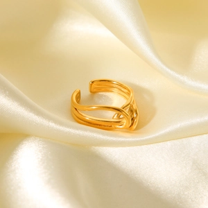 Detailed macro view of 18K gold plated multi-layer knot ring with polished finish