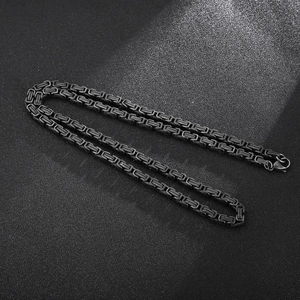 Detailed macro view of black Byzantine chain necklace showing intricate metal link texture