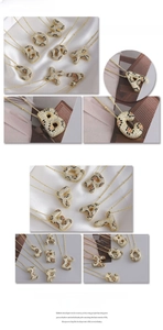Macro shot of 3D gold-plated letter pendant with leopard print zircon stones on a bead chain