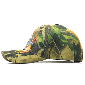Detail of jungle camouflage baseball cap featuring side eagle embroidery and stitching