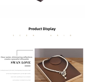 Detail of elegant pearl necklace on a dark brown display stand with wood background