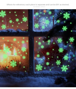 Luminous snowflake window stickers glowing in green with star and dot patterns for DIY decor