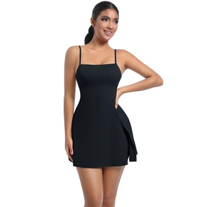Detail view of black athletic dress featuring slim straps and high side slit design