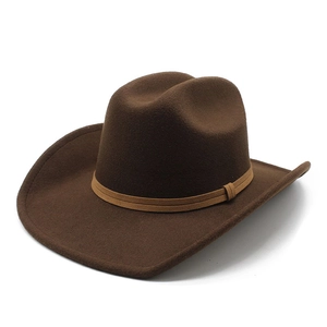 Close-up of dark brown felt wide-brim western cowboy hat with decorative suede band