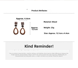 Detailed view of wood geometric drop earrings with square stud and hollow teardrop design