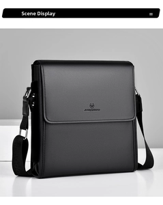 Detail of black pebbled leather texture and adjustable nylon strap on a men's messenger bag