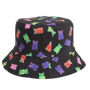 Women's black bucket hat featuring colorful gummy bear prints and reversible sun protection