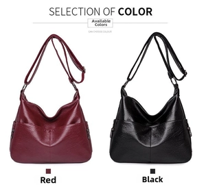 Detail view of burgundy and black PU leather hobo bags with adjustable straps