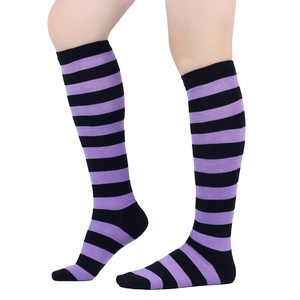 Detail of purple and black striped knee-high socks showing the elastic ribbed cuff