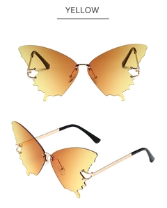 Macro detail of butterfly shaped yellow gradient lenses with wavy edges and gold temples