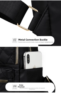 Detail view of the black nylon backpack side pocket and shiny gold hardware connection buckle