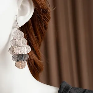Minimalist silver irregular leaf fringe earrings with intricate cutout mesh design for women