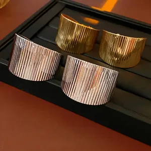 Chunky geometric stripe pattern open cuffs in gold and silver plating finish