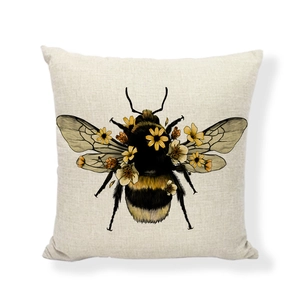 Detailed view of square linen pillow cover featuring a floral bee illustration on white background