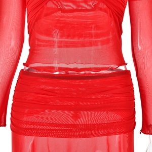 Detail of red mesh sheer two-piece set featuring pleated fabric and soft tulle texture