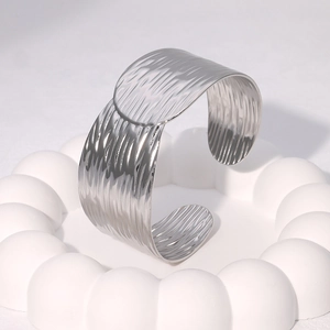 Irregular textured silver open bangle bracelet in stainless steel with water ripple effect